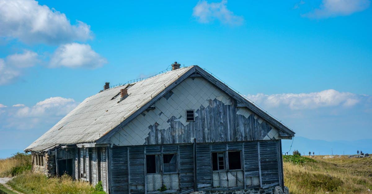 My Terraria NPC will not settle down in a house - Gray Wooden House on Green Grass Field Under Blue Sky