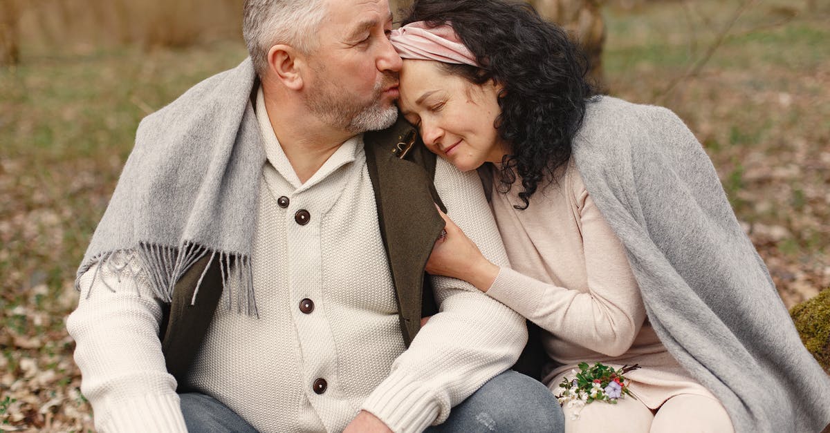 My wife disappeared, but we're still married. How can I fix this? - Happy senior couple hugging in autumn park