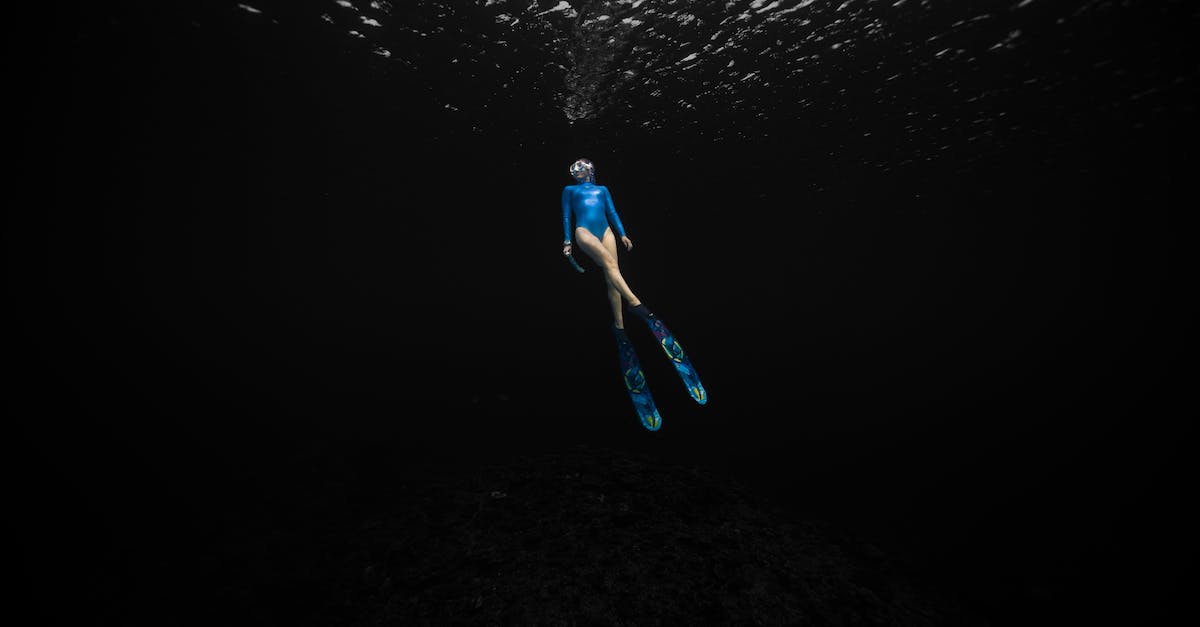 My WiiU should have 22GB of free space, but it has only 9GB instead - Female Free Diver Immersed in Dark Waters