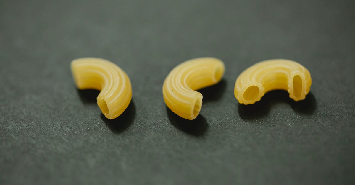 Name of the recipe for this type of wall? - From above of uncooked curvi rugati macaroni placed on gray table in kitchen