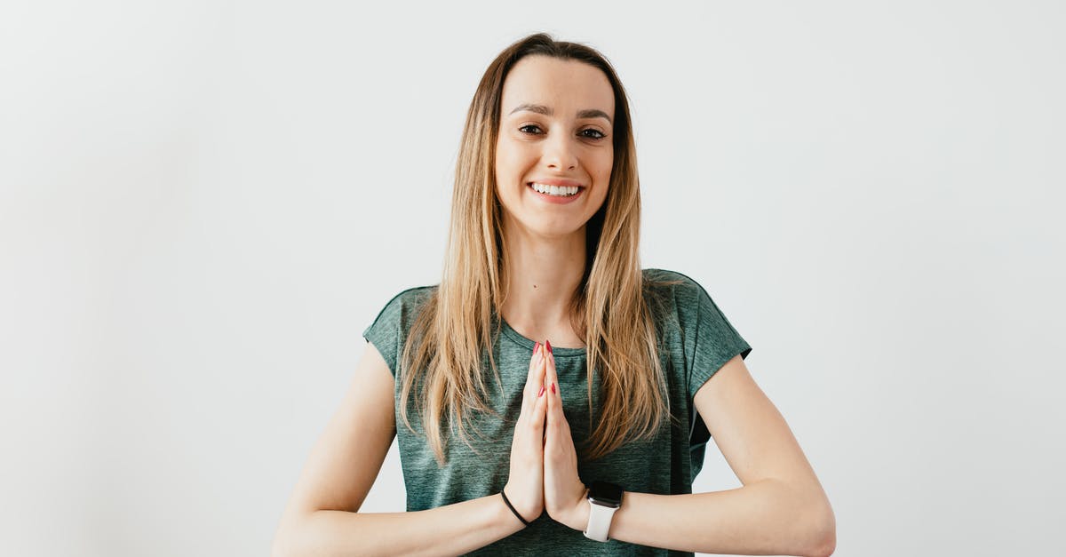 Nearby tracker doesn't refresh - Fit smiling lady standing with Prayer hands while practicing yoga