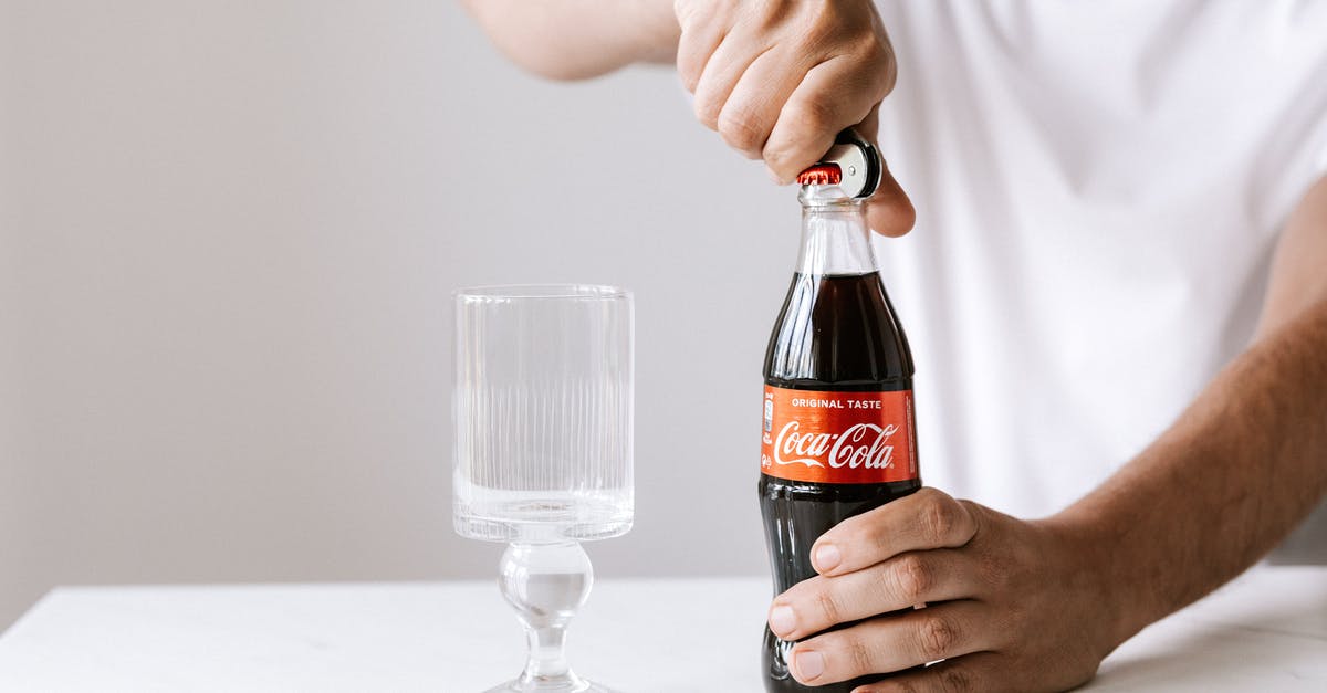 Nearby tracker doesn't refresh - Crop man opening glass bottle of cola
