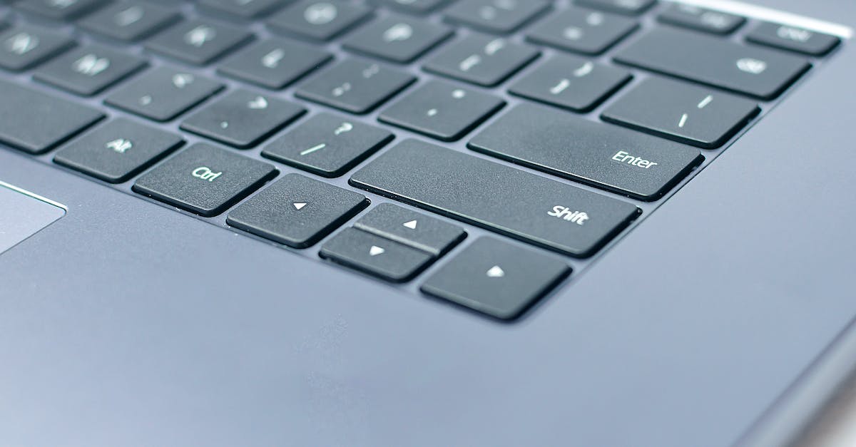 Need for Speed Hot Pursuit 2010 up arrow key + left arrow key don't work simultaneously - From above closeup of contemporary portable computer keyboard with words and symbols on black keys Need for Speed Hot Pursuit 2010 up arrow key + left arrow key don't work simultaneously - From above closeup of contemporary portable computer keyboard with words and symbols on black keys