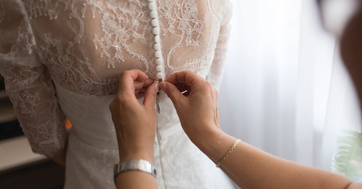 Need help fixing clan - Person Fixing Dress on Girl