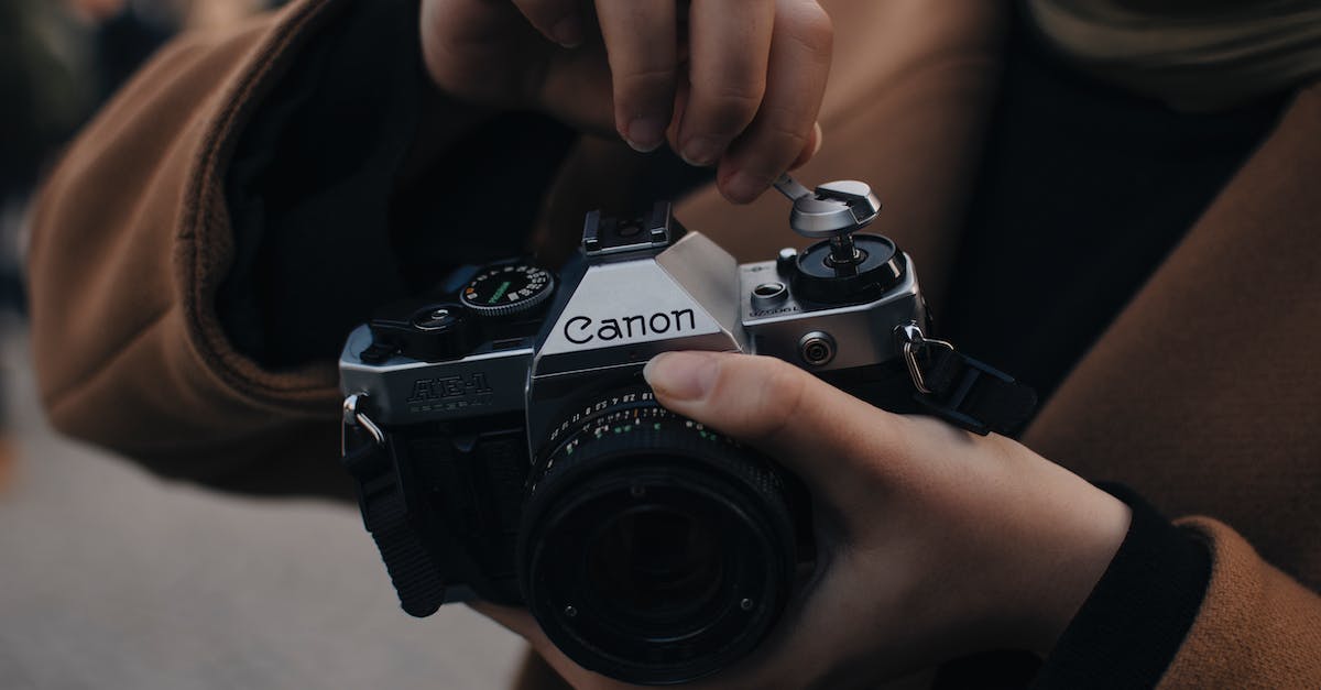 Nethack: Revive My Old Corpse? - Photographer preparing old photo camera to take photo
