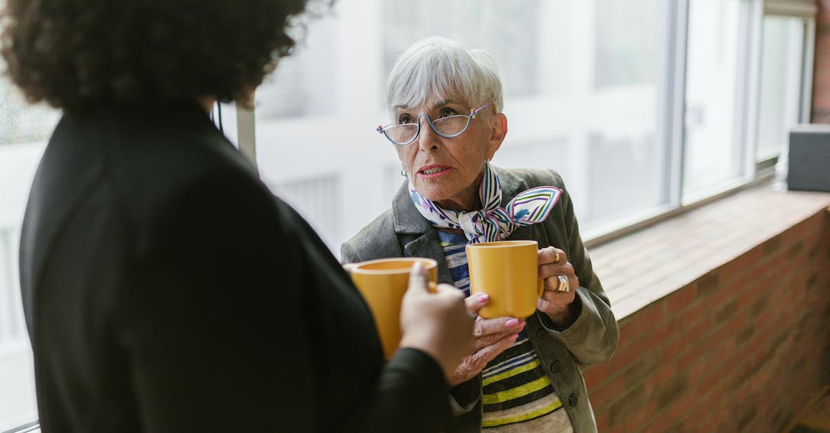 Nethack: Revive My Old Corpse? - Women Holding Yellow Cups with Coffee