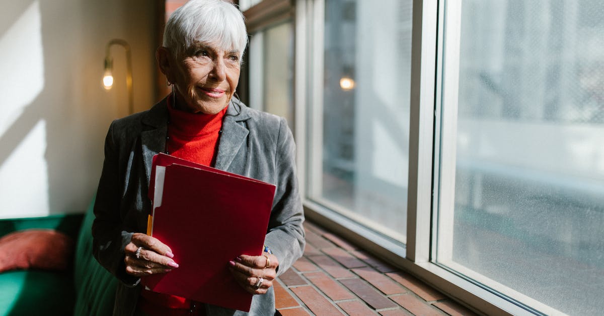 Nethack: Revive My Old Corpse? - Woman in Gray Blazer Holding Red Book