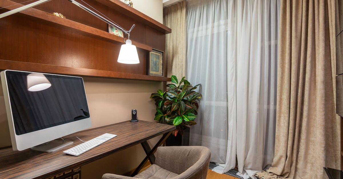 New Computer- Port forwarding stopped working - Interior of stylish room with computer placed on wooden table in modern apartment