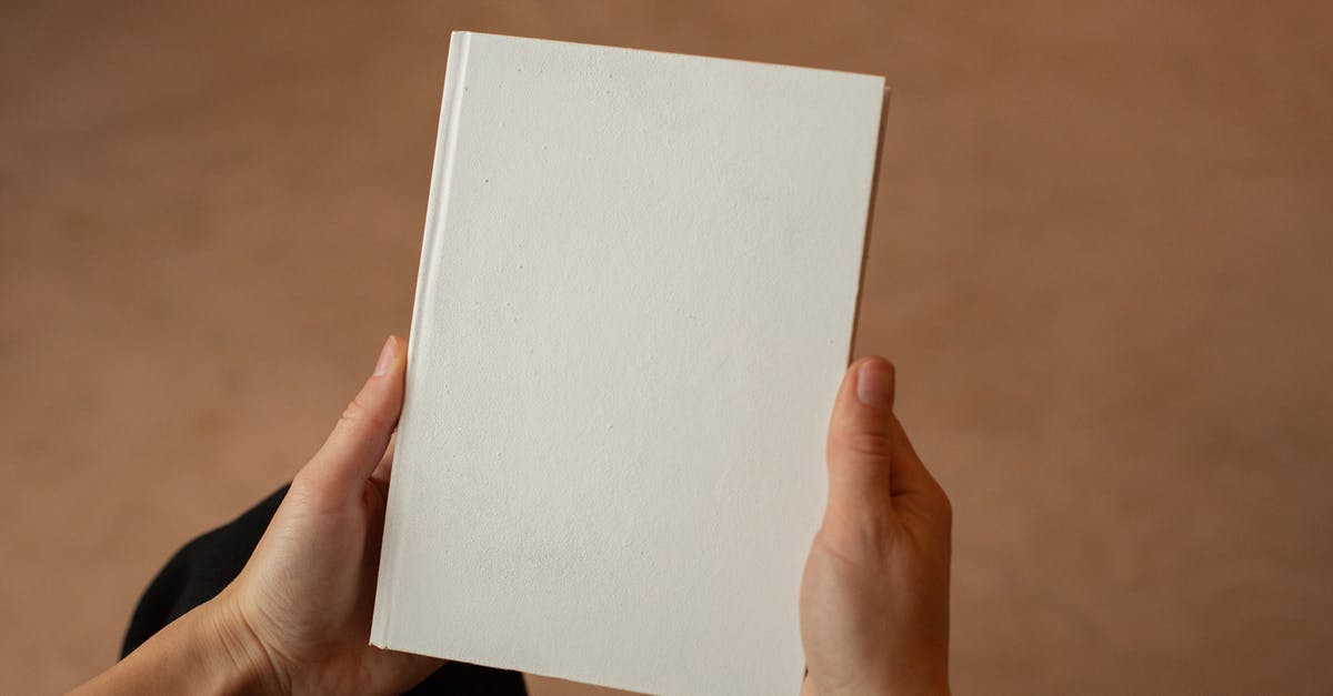 New Research After Level 9? - Person holding hardcover book with blank cover