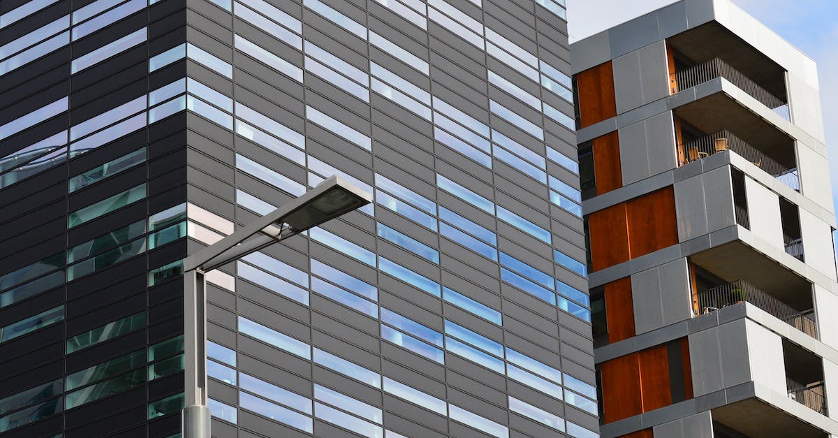 New to it... what does "business demand" mean in Tiny Tower? - Gray Concrete Building