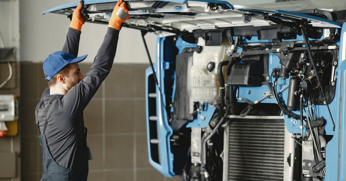 No jobs available in Euro Truck Simulator 2 - Man in Working Clothes Looking Under the Hood of Blue Truck