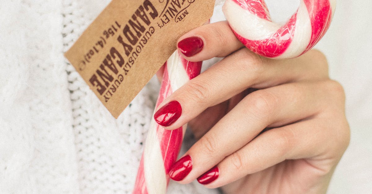 No more sugar canes [closed] - Person Holding Candy Cane