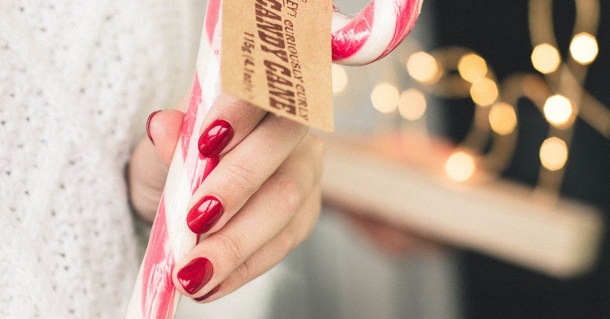No more sugar canes [closed] - Close-Up Photo of Person Holding Candy