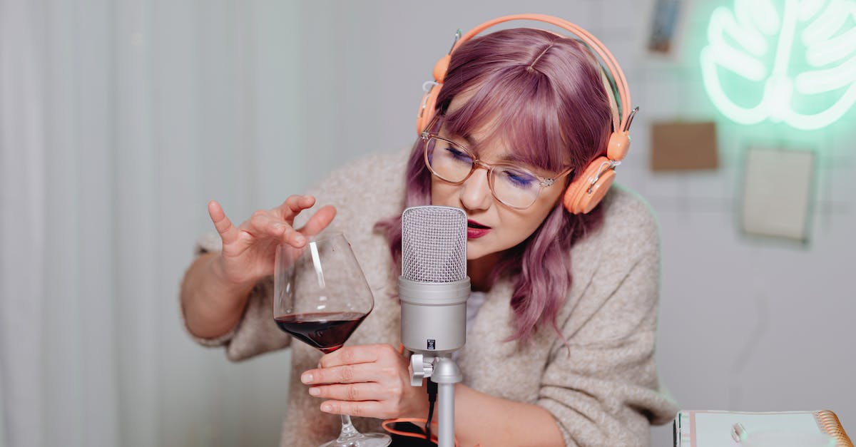 No sound in wine - A Woman Holding a Wine Glass Near a Microphone No sound in wine - A Woman Holding a Wine Glass Near a Microphone