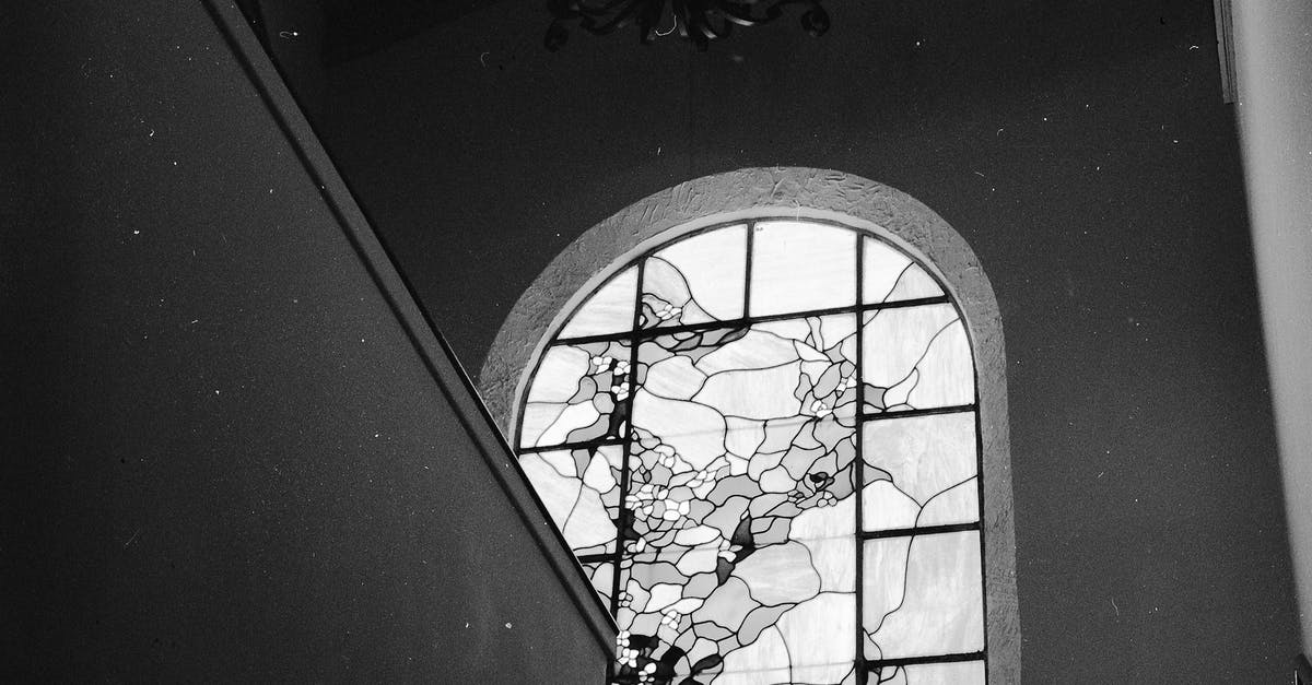No stained glass? - Grayscale Photo of a Stained Glass Window with Grills