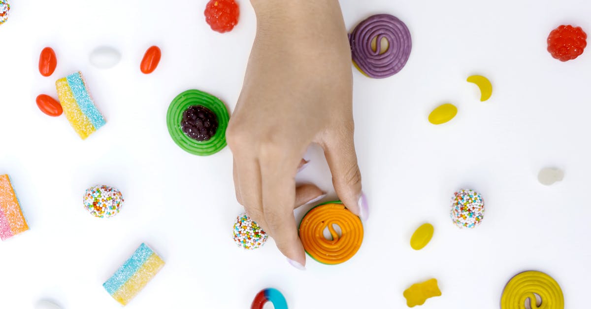 Not getting candy for Pokemon transfer - A Person Holding a Round Chewy Candy Not getting candy for Pokemon transfer - A Person Holding a Round Chewy Candy