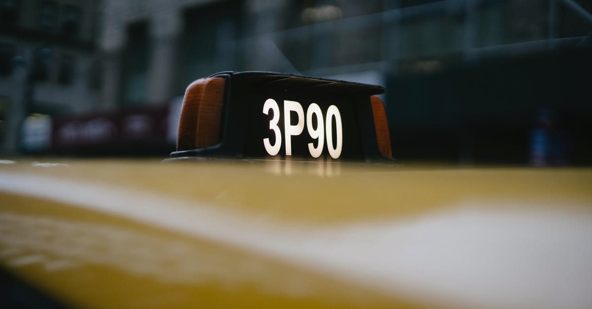 Not possible to sign players based in England on free transfer - Modern yellow taxi roof with number sign on black background