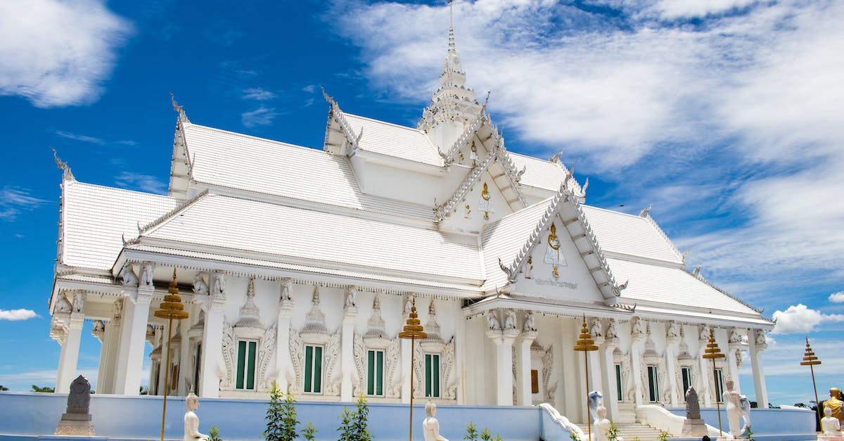 Nothing happens when I reach the tower entrance - White temple under blue sky with clouds