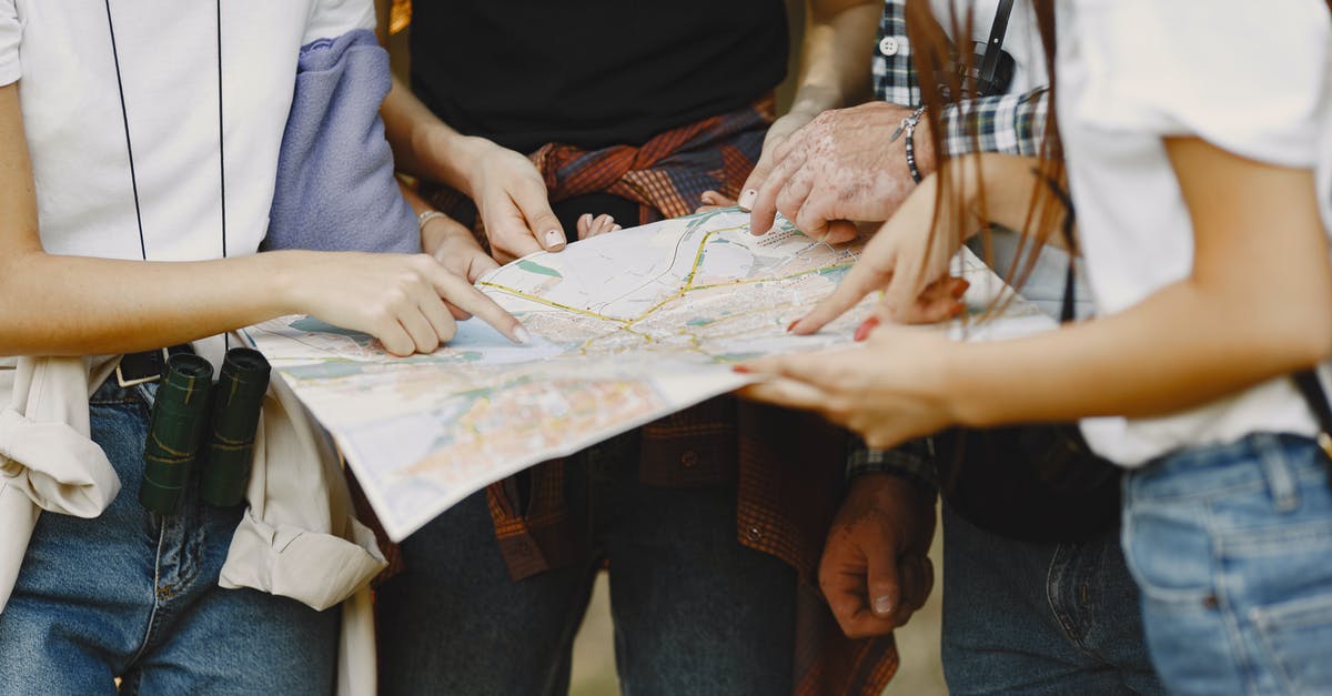 Nothing shows up on the map - Woman in Black Tank Top and Blue Denim Jeans Sitting on White Textile
