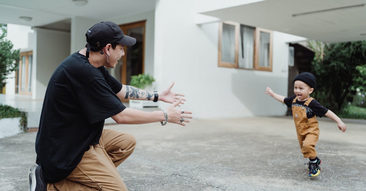 NPC won't settle down in one of my houses - Shot of a Man Playing with a Boy in Front of a House NPC won't settle down in one of my houses - Shot of a Man Playing with a Boy in Front of a House