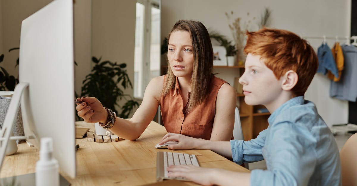One son used other sons gmail account [duplicate] - Photo Of Woman Tutoring Young Boy