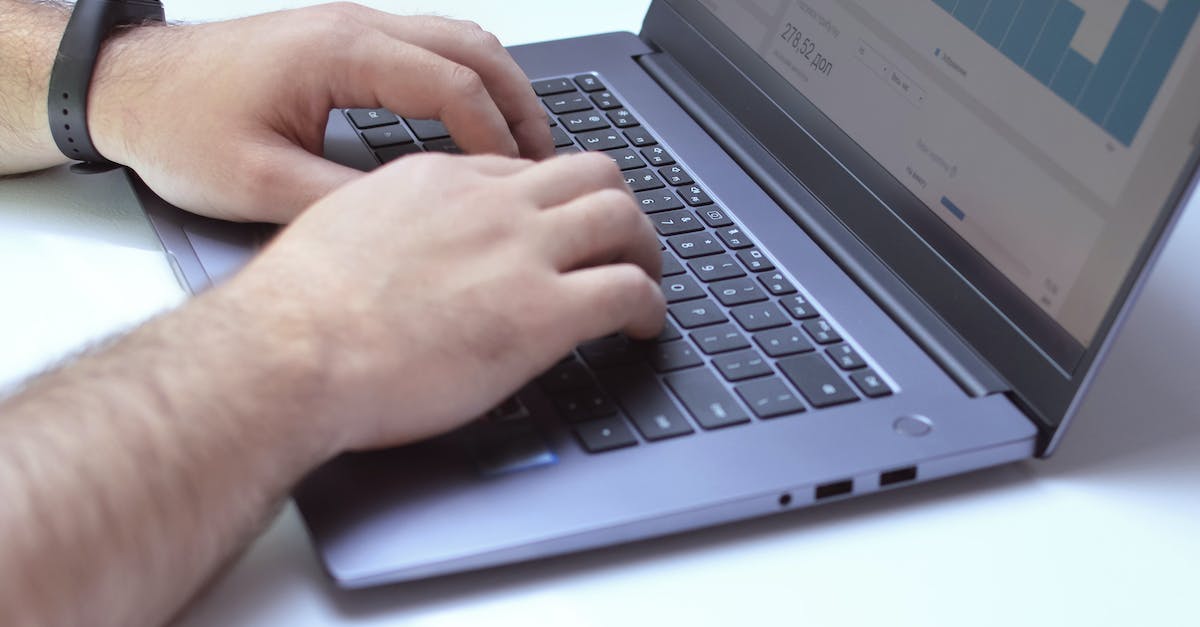 Online Weapon Progress - Crop analyst typing on laptop while working with graphs Online Weapon Progress - Crop analyst typing on laptop while working with graphs
