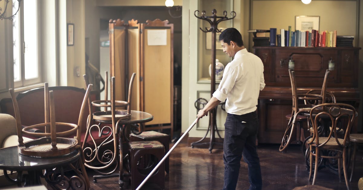 Only one housekeeper cleans an entire floor? - Male employee cleaning floor in restaurant Only one housekeeper cleans an entire floor? - Male employee cleaning floor in restaurant