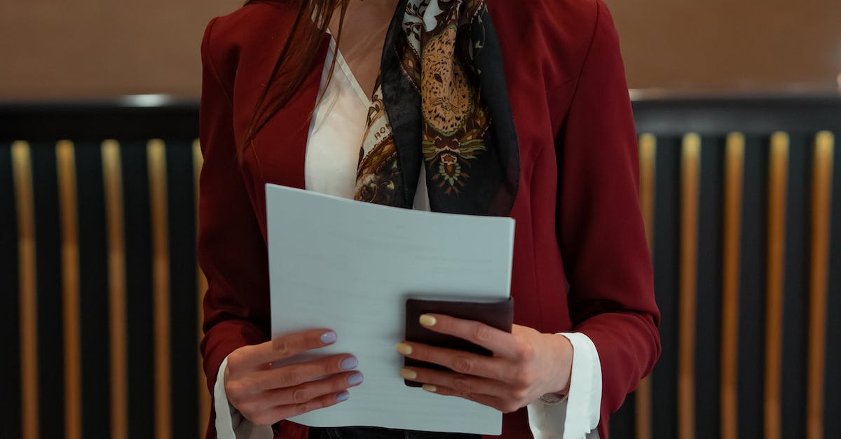 Op levels for staff - Person in Red Blazer Holding White Paper Op levels for staff - Person in Red Blazer Holding White Paper