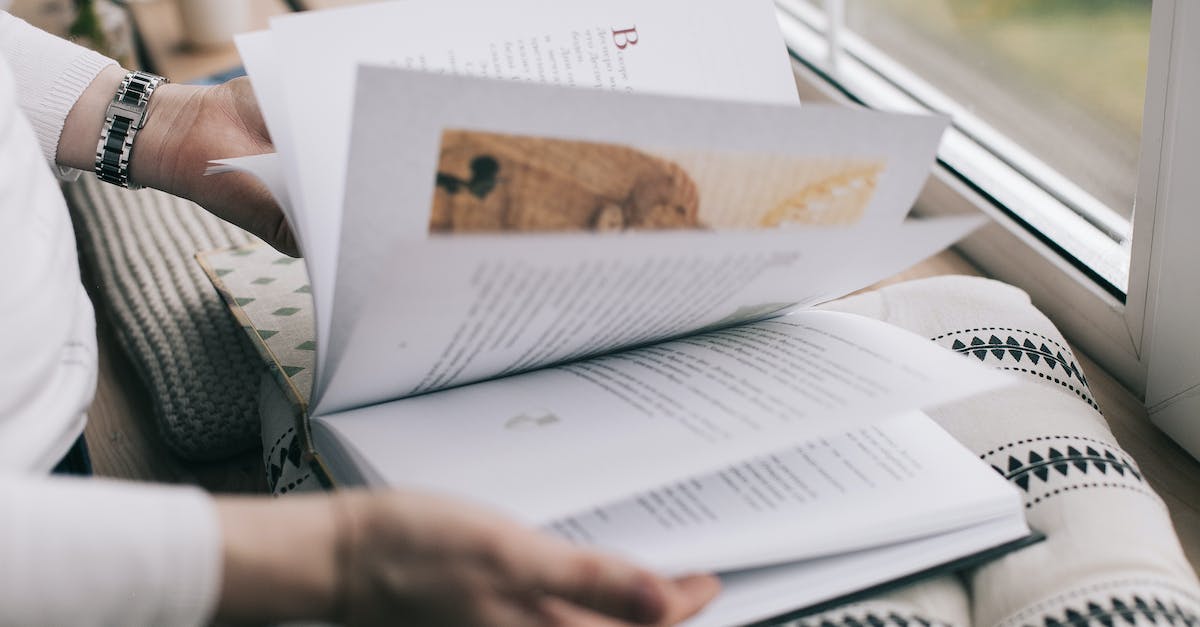 Open level up window - Hands with Open Book on Pillow
