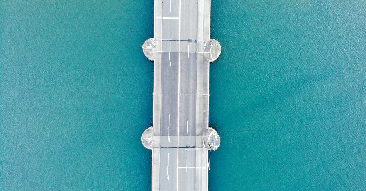 Optimal First Clear Route for Gragas? - Drone view of modern asphalt bridge over blue water