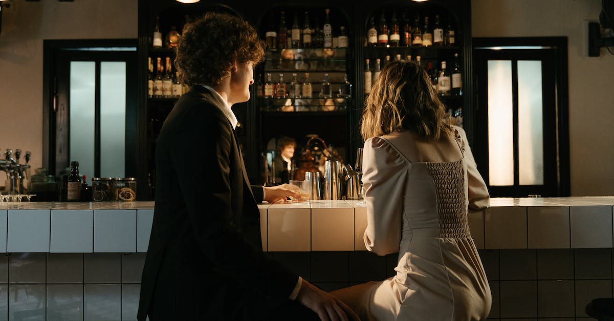 Orange bar on the side of chat - Man and Woman Sitting on Counter Orange bar on the side of chat - Man and Woman Sitting on Counter