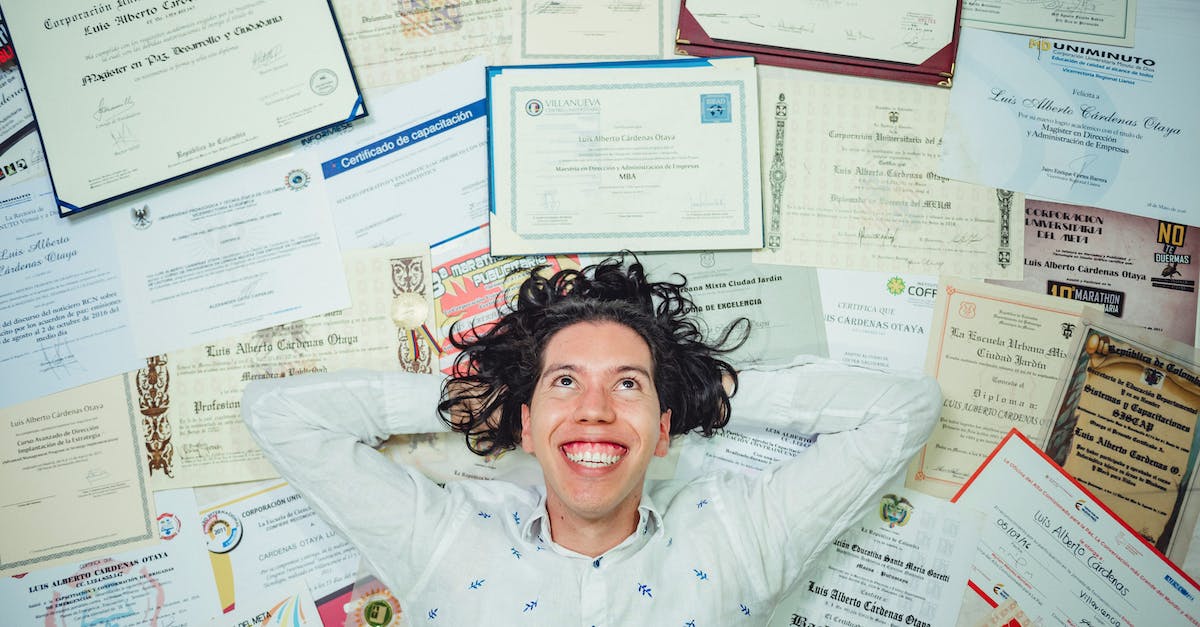 Origin of achievements - Man Lying On Certificates