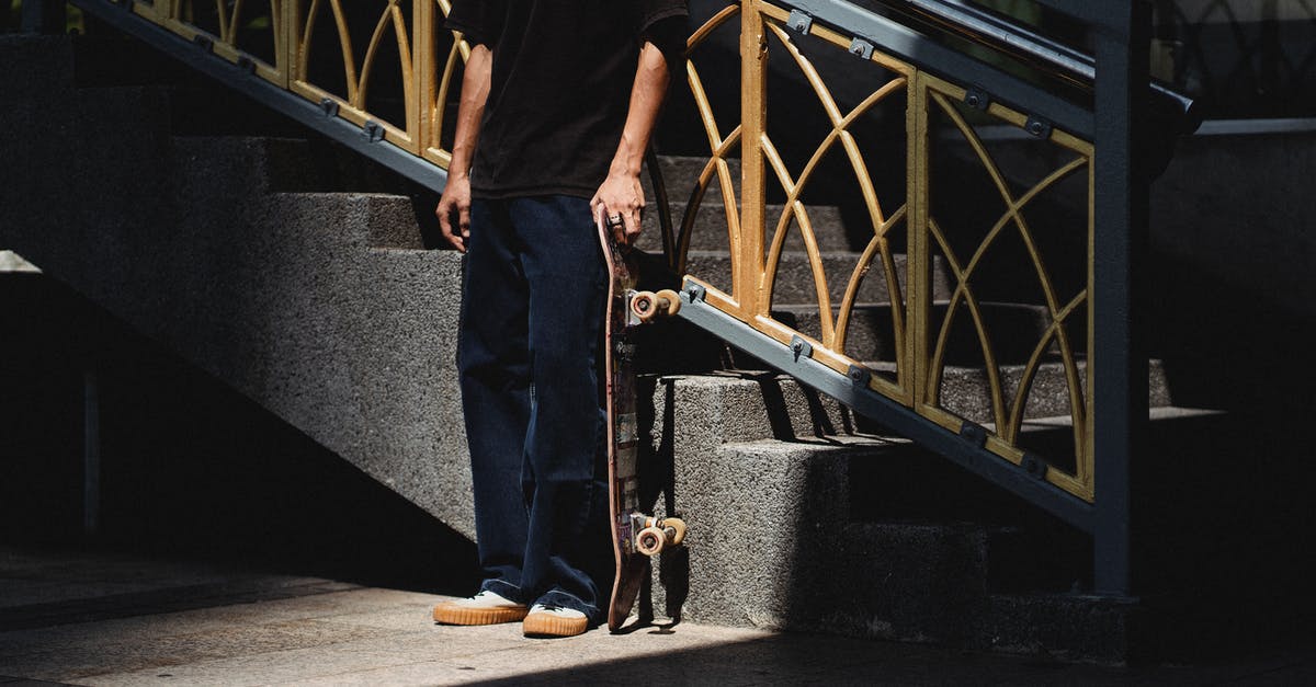 Passing down an ability in Pokémon Black 2 - Unrecognizable male in black outfit with skateboard standing on sidewalk near stone staircase with metal railing on street in sunlight Passing down an ability in Pokémon Black 2 - Unrecognizable male in black outfit with skateboard standing on sidewalk near stone staircase with metal railing on street in sunlight