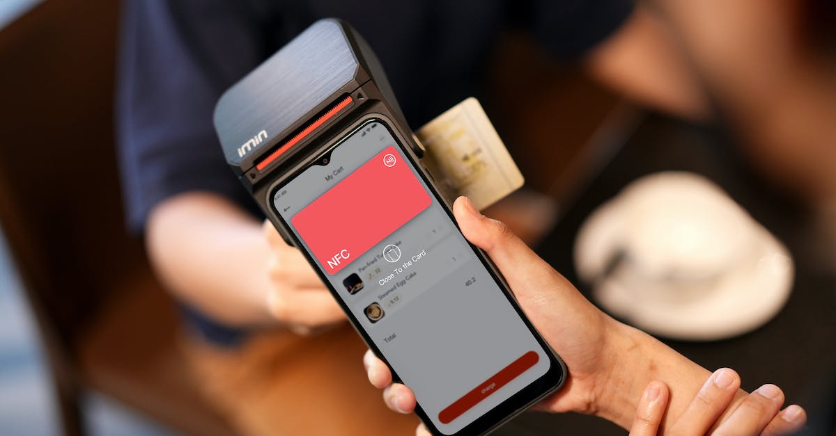 Paying credits after a failled spacemission - Person Holding Silver Iphone 6