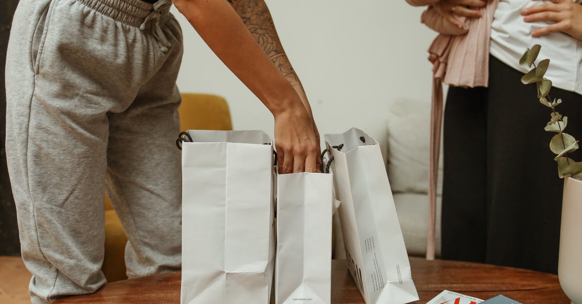 People getting healthy after they get infected - Person in Gray Pants with Hand Inside White Paper Bag