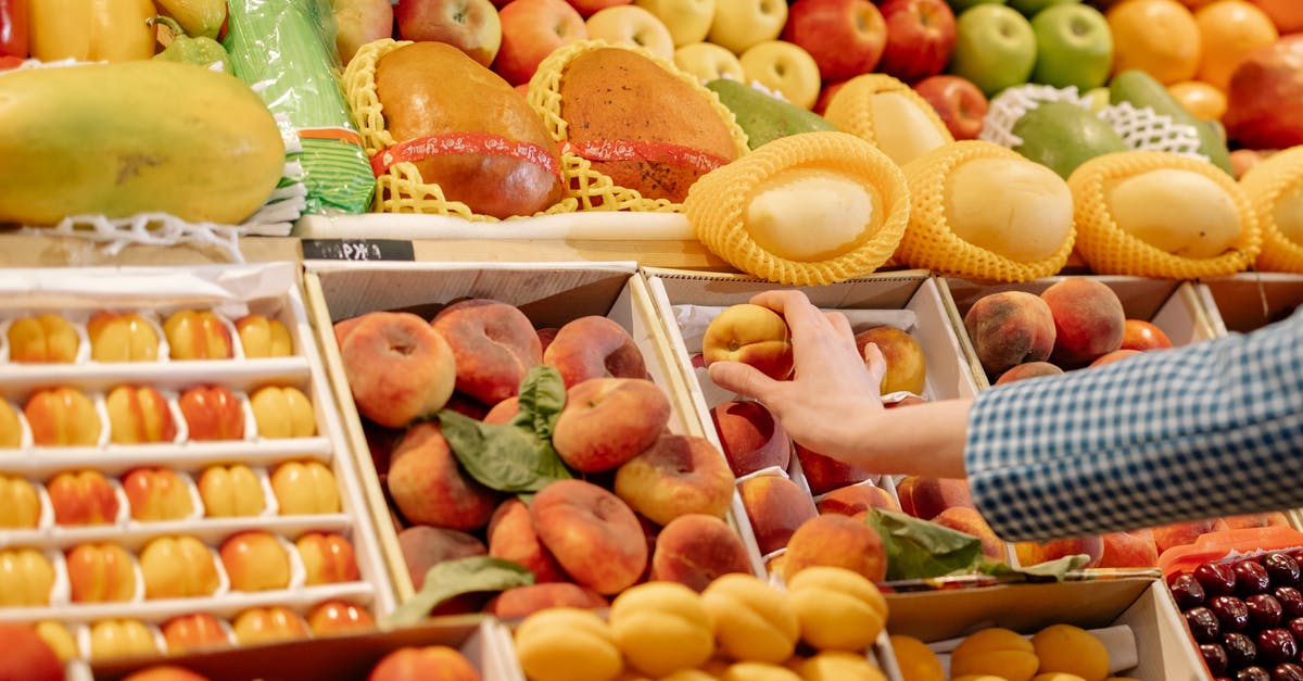 People getting healthy after they get infected - A Person Holding a Fruit