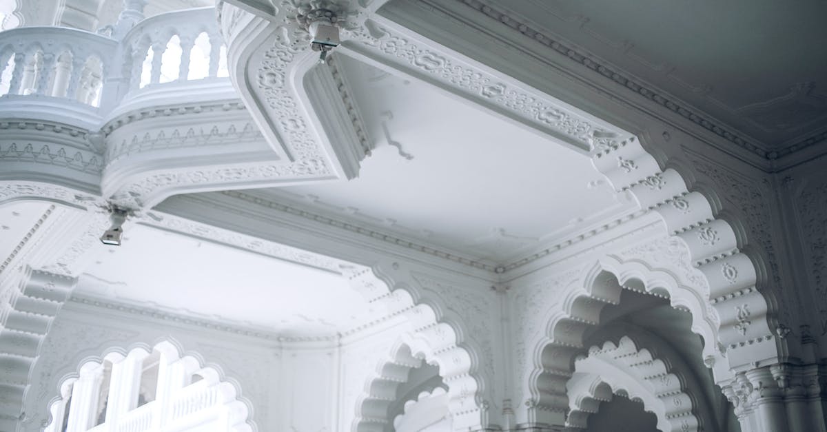 Placed all stone what shall I do now? - From below of classic arched castle in baroque style with stone fence and ornamental elements