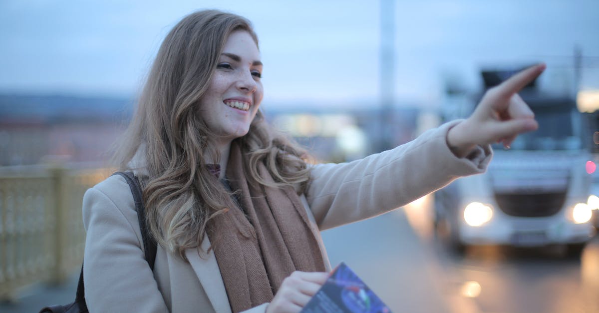 Placing a chest so it faces a specific direction - Woman in Beige Coat While Smiling