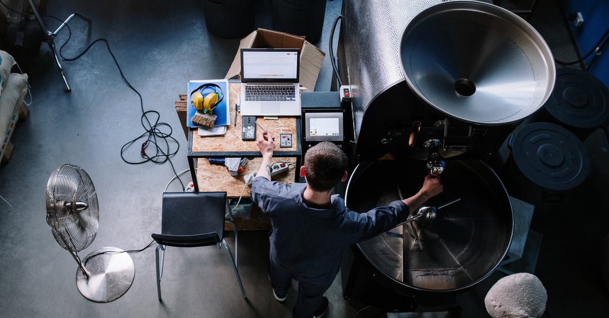Placing a sign, given from a generator, not working - Man in Black Jacket Holding Black Video Camera Placing a sign, given from a generator, not working - Man in Black Jacket Holding Black Video Camera