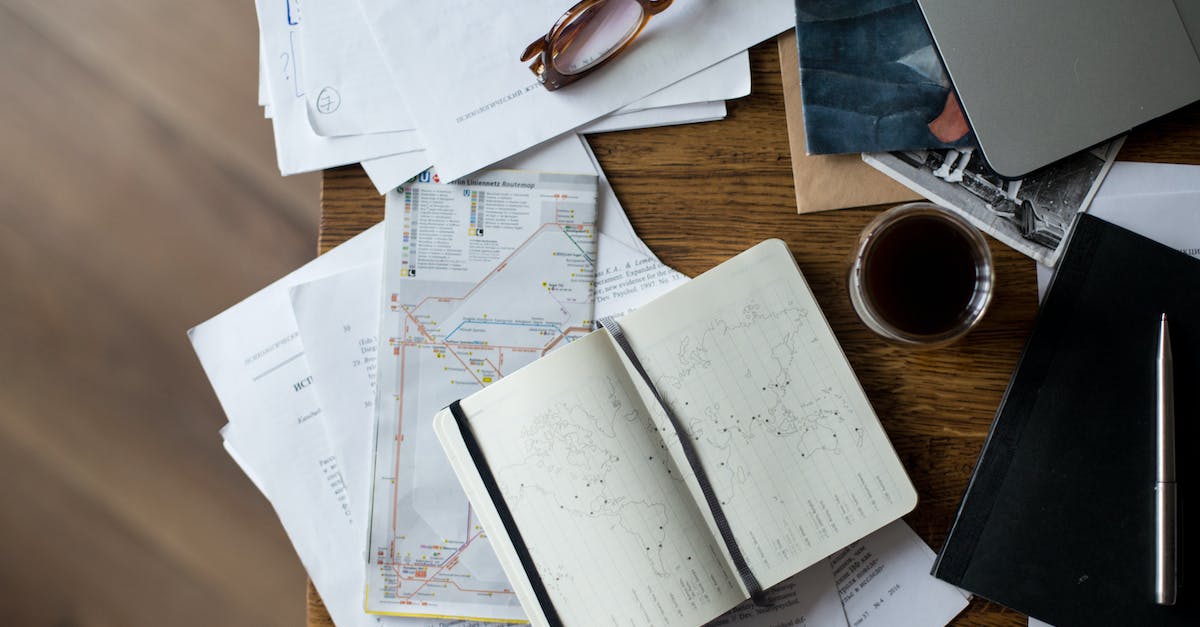 Placing Maps in Minecraft - Brown Framed Eyeglasses on White Printer Paper Beside White Ceramic Mug