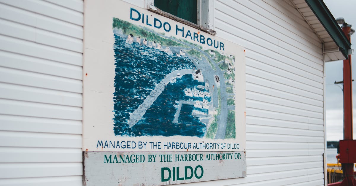 Placing the secondary ID name - Signboard on cottage with location name Dildo Harbour Placing the secondary ID name - Signboard on cottage with location name Dildo Harbour