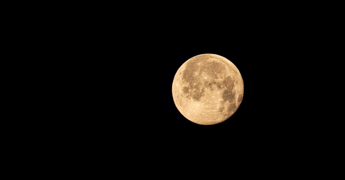 Plague Inc. full version - From below of big bright yellow full moon shining in dark sky at night