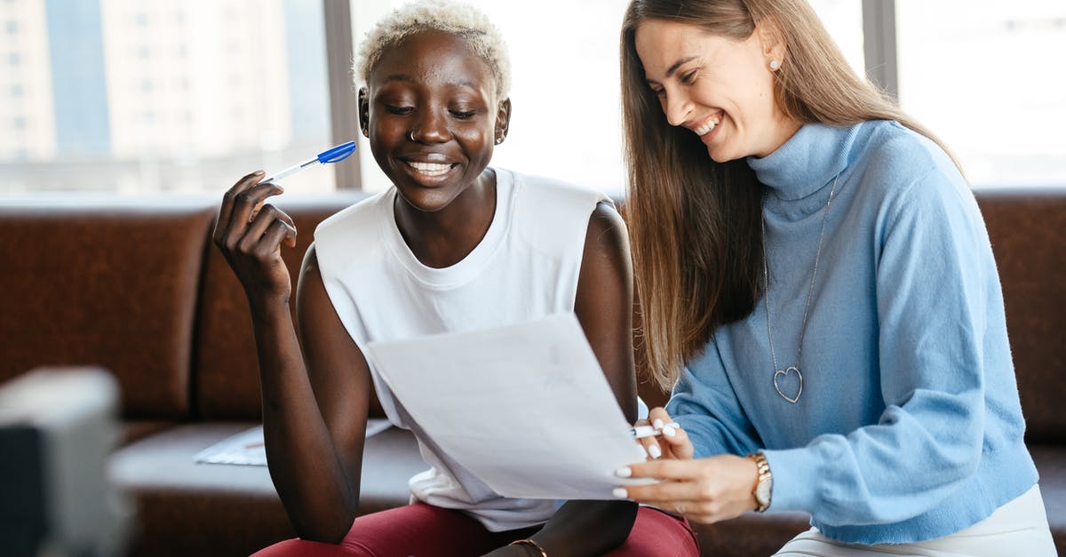 Planetary Scan Job does not show the target - Positive diverse women checking information in document of agreement and smiling together in office Planetary Scan Job does not show the target - Positive diverse women checking information in document of agreement and smiling together in office