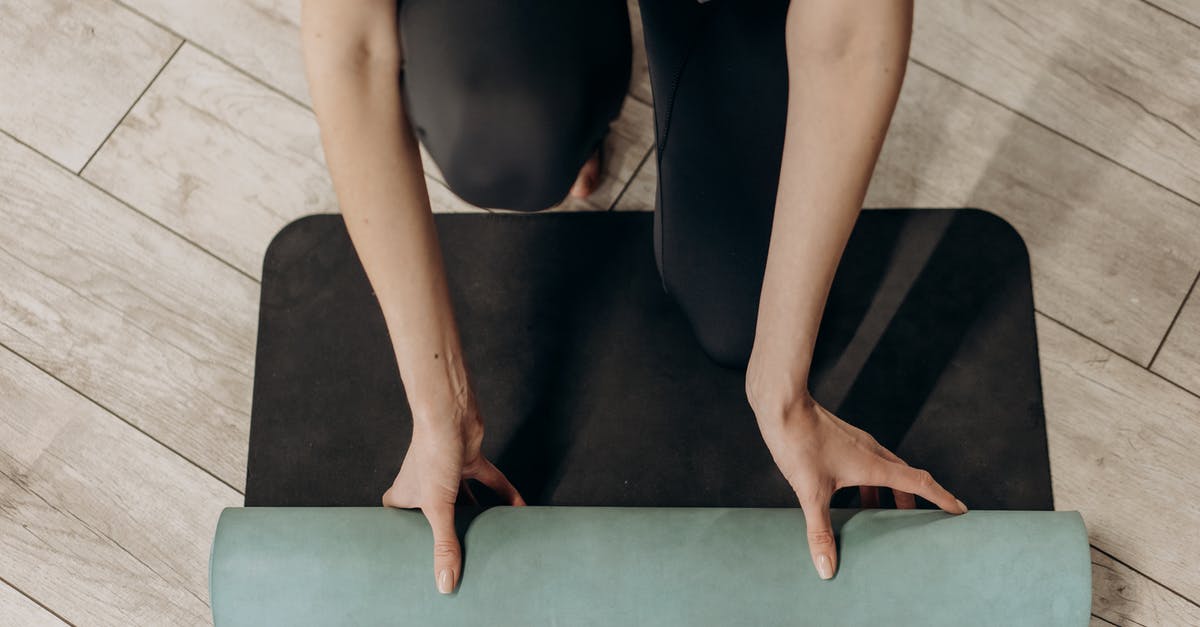 Players forget newly trained position - Woman in Black Leggings Unrolling A Yoga Mat