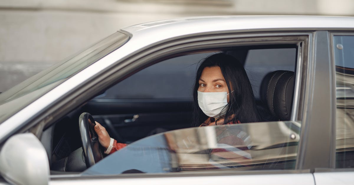 Players who join my world can't open chests - Young woman wearing medical mask driving car Players who join my world can't open chests - Young woman wearing medical mask driving car
