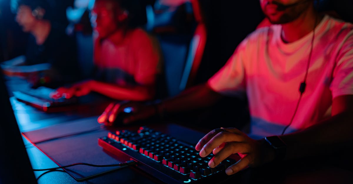 Playing Catherine on PSNow with Keyboard & Mouse - Man in Red Shirt Using Computer