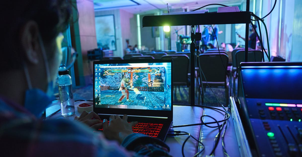 Playing games over different profiles - A Man Playing Games on a Computer