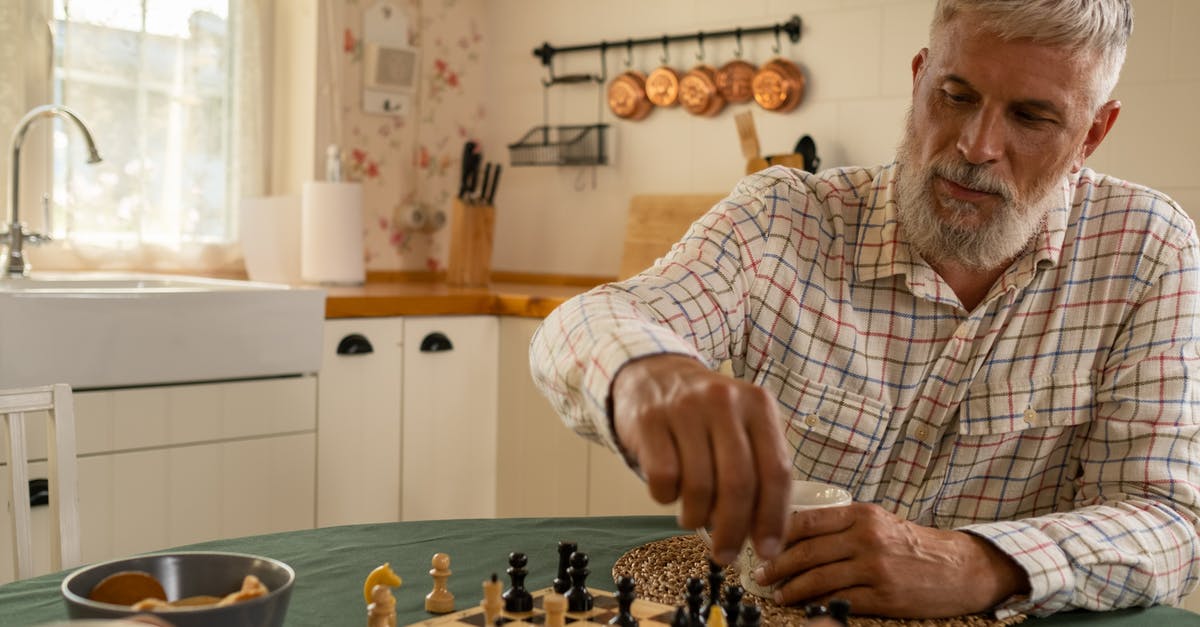 Playing Minecraft Demo Mode Immediately by Moving Files - Elderly Man Moving Chess Piece Across Board