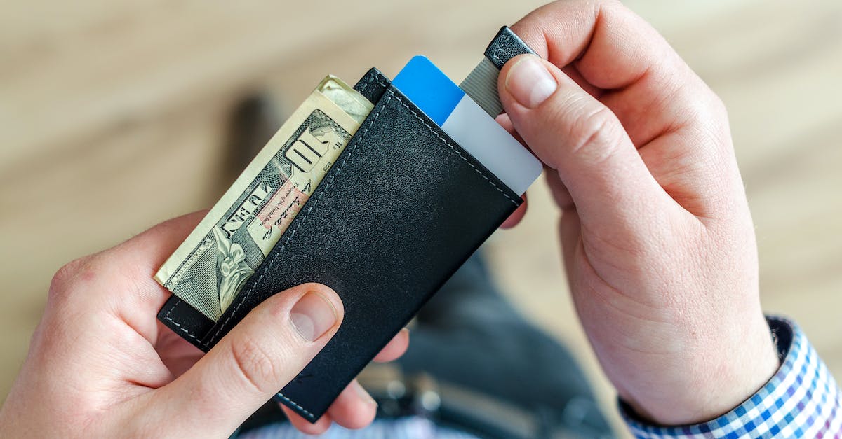 Playstation Now - Is there any way to use my PSN wallet only, instead of having to add a credit card info? - Person Holding Black Card Holder