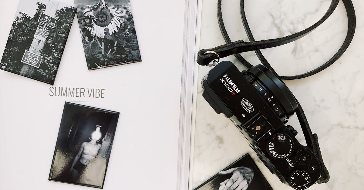 Playstation Plus Instant Game Collection on same device, from multiple countries - Photo camera placed on white surface near album with pictures Playstation Plus Instant Game Collection on same device, from multiple countries - Photo camera placed on white surface near album with pictures